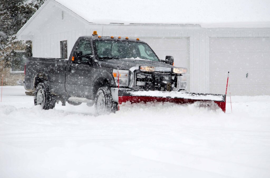 Stock - Pickup Truck clearing snow at house